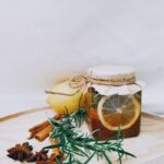 Photo Of Jar Near Cinnamon Sticks